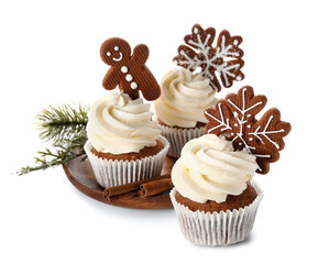 Plate of tasty Christmas cupcakes with gingerbread cookies on white background