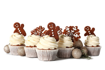 Tasty Christmas cupcakes with gingerbread cookies and balls on white background
