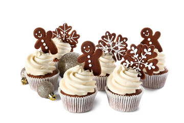 Tasty Christmas cupcakes with gingerbread cookies and balls on white background