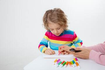 little child drawing with crayons