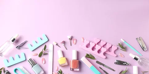  Concept of nail care with manicure accessories on pink background © Atlas