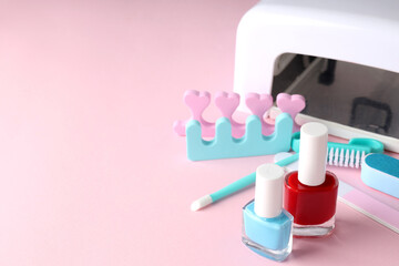 Concept of nail care with manicure accessories on pink background