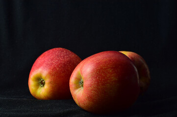 Close up, red apple on, black background and copy space.