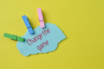 Torn paper written with text CHANGE THE GAME