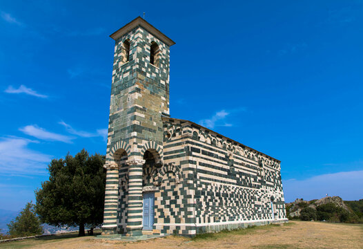 View of the famous Church of San Michele de Murato, a small chapel in polychrome stones and typical pisan romanesque style in village of Murato, Haut-Corse, France
