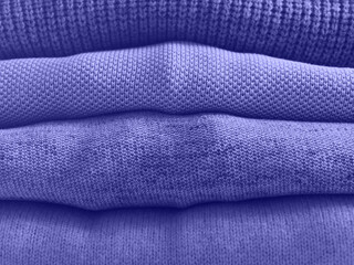 Purple trendy color winter sweaters stack in shop - 476717027
