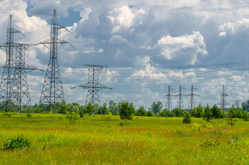 Silhouette of high voltage poles, power tower, electricity pylon, steel trellised tower, in the...