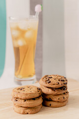 A lot of chocolate chip cookies and iced tea.