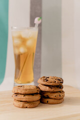 A lot of chocolate chip cookies and iced tea.