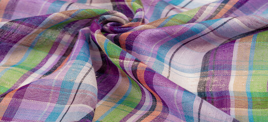 The background texture of the Scottish fabric, the name of which directly indicates the country of its origin. The second and more accurate name of this material is tartan.