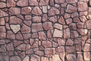 Fence masonry. Rubble stone. Texture