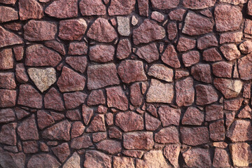 Fence masonry. Rubble stone. Texture