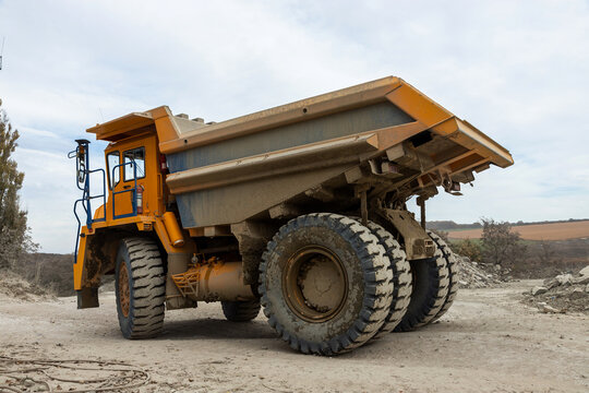 Large mining dump truck. Transport industry. Extraction of stone in an open pit