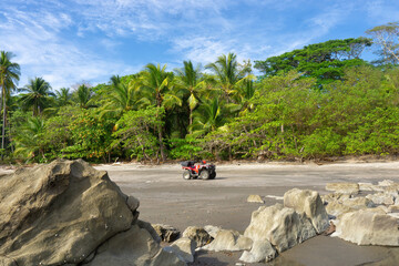 Quad bike on a rocky beach of Costa Rica