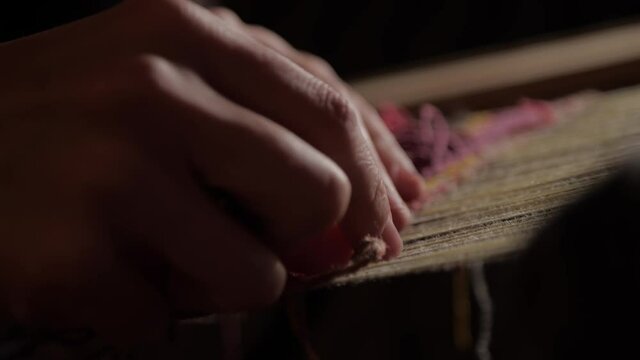 Handmade tapestry in slow motion