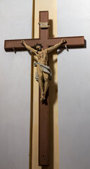 Jesus christ on the cross with Wall background in catholic church
