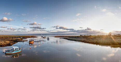 Fototapeta premium Fishing boats moored at Stone Creek inlet, Sunk Island, East Yorkshire, UK