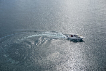 The boat maneuvers on the water in Lake Baikal