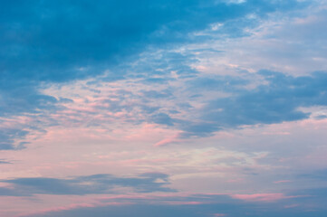 Naklejka na ściany i meble Photo of the sky with clouds, sunrises, sunsets, orange-yellow tones from the setting sun
