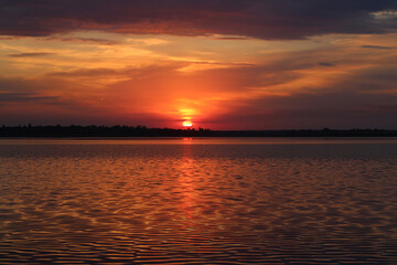 Red sunset into the water 