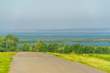 Fototapeta na wymiar Summer landscape, local road, end of August. European part of the world