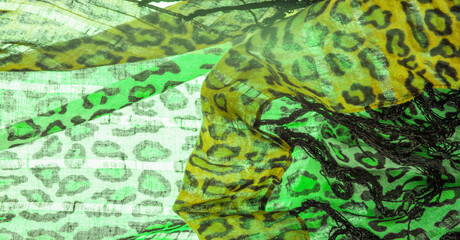 Texture, background, pattern, silk fabric green yellow with leopard print. Lightweight leopard print silk is perfect for your design, looks stylish and not vulgar!