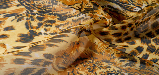 background pattern African fabric with silk print Savannah with tiger print. This amazing fabric will help you to plunge into the world of unbridled savannah. You will be sensual with design projects
