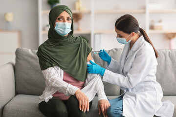 Senior Muslim Lady Patient Getting Vaccinated Against Covid-19 Indoors