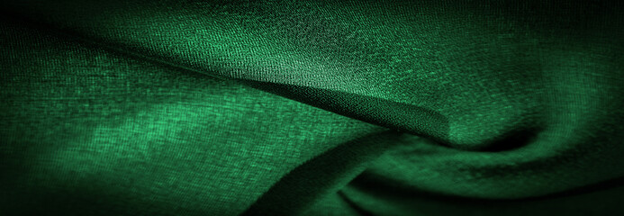 Background texture Dark green chiffon silk is a soft transparent fabric with a slight roughness...