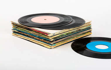 Fototapeta premium Vinyl records in a stack on a white background.