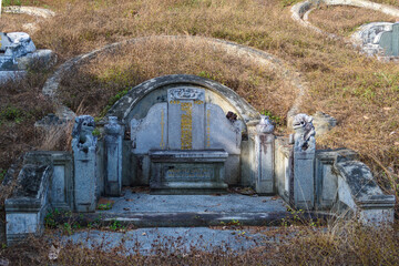 Chinese style grave in the Chinese graveyard on Bukit Cina (Chinese Hill), Malacca City, Malaysia.