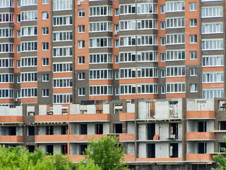 Fototapeta premium Construction of a modern residential building. Abstract architecture, a fragment of modern urban geometry