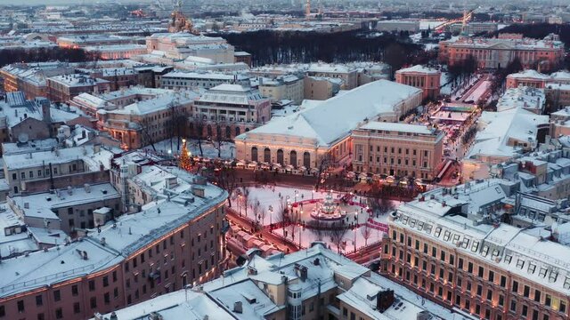St. Petersburg, Russia, winter 2021: aerial view City center new year illumination, snow covered winter city and fair