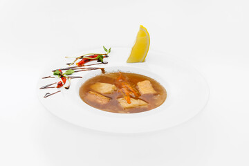 Soup in a plate - healthy food, meat, carrots, vegetables. Isolated