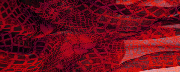 Texture, background, pattern. Ruby red lace fabric, a combination of red with black fabric....