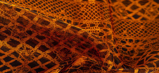 Texture, background, pattern. Gold lace, a combination of yellow gold with black fabric. red,...