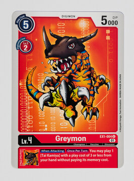 Hamburg, Germany - 12242021: picture of the english Digimon card Greymon from the Classic Collection EX01 series on white background. The Digimon collectible card game is similar the pokemon tcg.