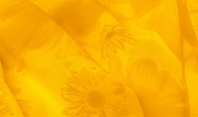 Background texture, yellow silk fabric with painted meadow flowers, colors between green and orange...