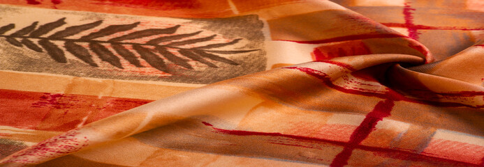 Texture. Background. Template. red and yellow brown silk fabric with abstract pattern, print made...