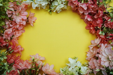 Flower border frame with space copy on yellow background