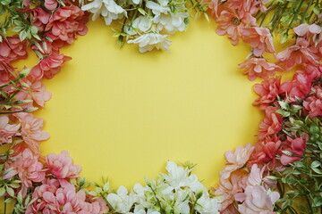 Flower border frame with space copy on yellow background