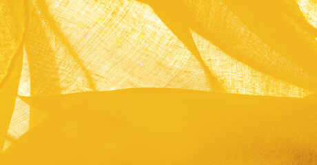 Texture. Background fabric of silk yellow matte color (paint or surface) is dull and flat, without shine.