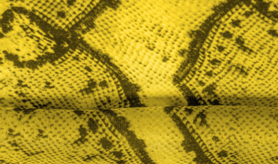 Background, texture, pattern, yellow fabric with a pattern of yellow squares, lines,