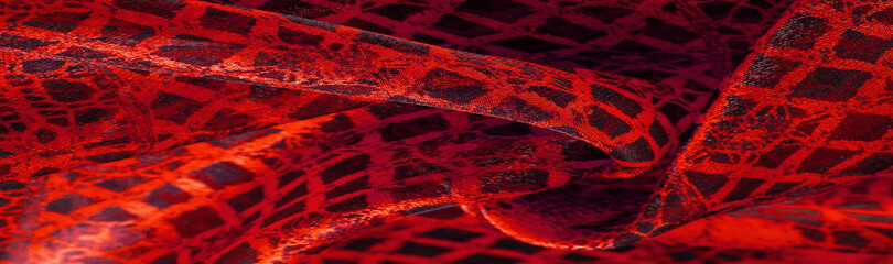 Texture, background, pattern. Ruby red lace fabric, a combination of red with black fabric. blushing, ruddy, florid, gules, blushful