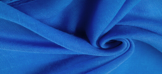 Texture. Background fabric of silk blue matte color, (paint or surface) is dull and flat, without...