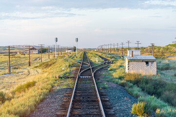 railway, railroad, rail, elevated. steppe prairie veld. is a means of transportation and passengers of trucks moving on rails that are located on the rails of the Great Plains. Kazakhstan The steppe 