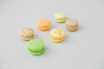 Macaroons on gray background. Multicolored French pastry macarons. Valentine's Day gift