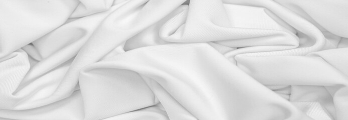 White silk fabric. Texture. Background. Pattern. Dupioni silk fabric has a shiny sheen and characteristic small folds that run horizontally. She lies down in soft folds - obrazy, fototapety, plakaty