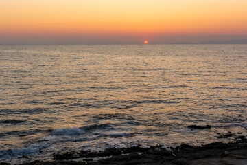 Obraz premium Beautiful sunset behind Kythera island. Natural beauty in an idyllic Greek island