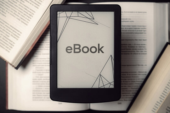 Readers. Digital e book, library reader tablet with books on dark background. Ebook, e learning electronic internet mobility concept.